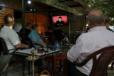 Middle East Tensions: People listen to a speech by Hezbollah leader Sayyed Hassan Nasrallah in a southern suburb of Beirut